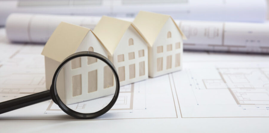 Construction blueprints, detailed design concept. Residence architectural drawings and magnifier glass. Architect engineer work space, office desk.