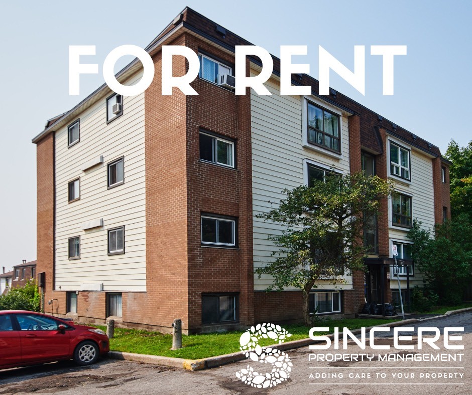 4 story building with multiple units for rent. Sincere Property Management logo in bottom right corner. FOR RENT in white font overlays photo